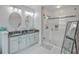Elegant bathroom featuring double sinks, granite counters, and glass shower for a spa-like experience at 135 Pier View St # 203, Charleston, SC 29492