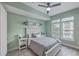 Serene bedroom features ample natural light and neutral decor at 135 Pier View St # 203, Charleston, SC 29492