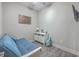 Guest bedroom featuring a convertible futon and modern decor for a versatile living space at 135 Pier View St # 203, Charleston, SC 29492