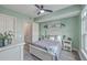 Bright bedroom features neutral tones, ceiling fan, and closet access for a relaxing retreat at 135 Pier View St # 203, Charleston, SC 29492