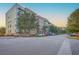 Modern apartment complex featuring a brick facade and ample parking at 135 Pier View St # 203, Charleston, SC 29492