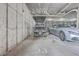 Well-lit garage space featuring a parked golf cart and a sleek, silver Maserati car, providing secure parking at 135 Pier View St # 203, Charleston, SC 29492