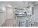 Open kitchen with stainless steel appliances, bar seating, and access to the entry at 135 Pier View St # 203, Charleston, SC 29492