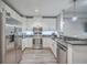 Bright kitchen features stainless steel appliances, granite countertops, and white cabinets at 135 Pier View St # 203, Charleston, SC 29492