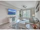 Cozy living room with a large TV, comfortable seating, and plenty of natural light at 135 Pier View St # 203, Charleston, SC 29492
