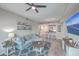Open living room with a comfortable couch, stylish area rug, and a TV at 135 Pier View St # 203, Charleston, SC 29492