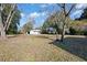 View of backyard with shed and mature trees at 1409 Main St, Bonneau, SC 29431