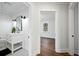 Bright bathroom with white vanity, modern lighting, and black and white tiled floor at 1409 Main St, Bonneau, SC 29431