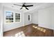 Light filled bedroom featuring hardwood floors and large windows at 1409 Main St, Bonneau, SC 29431