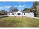 Charming single-story home with a well-maintained lawn, attached garage, and classic white siding at 1409 Main St, Bonneau, SC 29431