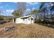Exterior view of detached shed with fire pit at 1409 Main St, Bonneau, SC 29431
