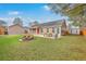 Backyard with fire pit and picnic table and a shed for additional storage space at 143 Moon Dance Ln, Summerville, SC 29483