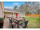 Outdoor dining patio with modern seating is ready for entertainment and relaxation at 143 Moon Dance Ln, Summerville, SC 29483