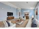Cozy living room featuring a modern TV, furniture, and a stylish rug at 143 Moon Dance Ln, Summerville, SC 29483