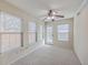 Bright sunroom with neutral carpet, ceiling fan, and lots of windows, creating a versatile and inviting space at 143 Moon Dance Ln, Summerville, SC 29483