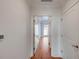 Hallway featuring hardwood floors and white trim with entry into other rooms at 155 Wingo Way # 423, Mount Pleasant, SC 29464