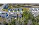 A picturesque suburban street with well-maintained homes borders a tranquil pond and natural wooded area at 162 Cherry Grv Dr, Summerville, SC 29483