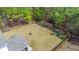 An expansive lawn with mature trees, a fire pit, and play set provides ample outdoor space at 162 Cherry Grv Dr, Summerville, SC 29483