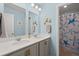 A charming bathroom with double sink vanity, coastal decor, and a starfish-themed shower curtain at 162 Cherry Grv Dr, Summerville, SC 29483