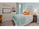 Cozy bedroom with a comfortable bed, natural light, and colorful accents at 162 Cherry Grv Dr, Summerville, SC 29483