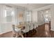 Elegant dining room with seating for eight, modern chandelier, and hardwood floors at 162 Cherry Grv Dr, Summerville, SC 29483
