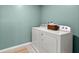 Laundry room featuring a white washer and dryer with a decorative basket on top at 162 Cherry Grv Dr, Summerville, SC 29483