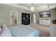 Spacious main bedroom with a television, ensuite bathroom, and walk-in closet at 162 Cherry Grv Dr, Summerville, SC 29483