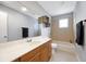 Bathroom featuring a light wood vanity, large mirror, and tiled bath at 166 Westminister Blvd, Goose Creek, SC 29445