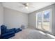 Bright bedroom with neutral paint, ceiling fan, and large windows for natural light at 166 Westminister Blvd, Goose Creek, SC 29445