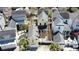 Overhead perspective of the yellow home with backyard, other homes in the community at 1676 Paradise Lake Dr, Mount Pleasant, SC 29464