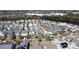 Aerial view shows a residential community with diverse home styles and well-maintained landscaping by the water at 1676 Paradise Lake Dr, Mount Pleasant, SC 29464