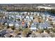 Wide aerial shot showcasing houses within a community near a picturesque lake at 1676 Paradise Lake Dr, Mount Pleasant, SC 29464