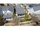 An aerial shot of a charming house with a manicured yard and a welcoming porch, surrounded by lush trees at 1676 Paradise Lake Dr, Mount Pleasant, SC 29464