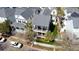 Aerial view of a neighborhood featuring well-maintained homes, lush greenery, and palm trees at 1676 Paradise Lake Dr, Mount Pleasant, SC 29464