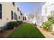Well-maintained backyard featuring lush green grass and manicured landscaping for outdoor enjoyment at 1676 Paradise Lake Dr, Mount Pleasant, SC 29464