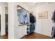 Walk-in closet featuring wood floors, organized shelving, and hanging racks at 1676 Paradise Lake Dr, Mount Pleasant, SC 29464