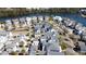 Aerial view showcases neighborhood surrounding the lake, highlighting community living at 1676 Paradise Lake Dr, Mount Pleasant, SC 29464