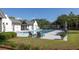 Community pool with deck chairs surrounded by trees and grass at 1676 Paradise Lake Dr, Mount Pleasant, SC 29464