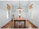 Charming dining room with wood floors and wainscoting at 1676 Paradise Lake Dr, Mount Pleasant, SC 29464