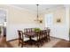 Formal dining room with elegant wainscoting, chandelier, and a large table at 1676 Paradise Lake Dr, Mount Pleasant, SC 29464