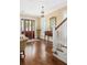 Bright foyer with hardwood floors, decorative mirror, and staircase at 1676 Paradise Lake Dr, Mount Pleasant, SC 29464