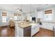 Bright kitchen with stainless steel appliances, granite counters, and a farmhouse sink at 1676 Paradise Lake Dr, Mount Pleasant, SC 29464