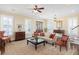 Cozy living room with shuttered windows, hardwood floors, and comfortable seating at 1676 Paradise Lake Dr, Mount Pleasant, SC 29464