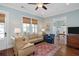 Cozy living room features hardwood floors, traditional furniture, and plenty of natural light at 1676 Paradise Lake Dr, Mount Pleasant, SC 29464