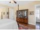 Spacious bedroom features a hardwood floor and a decorative cabinet at 1676 Paradise Lake Dr, Mount Pleasant, SC 29464