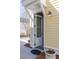 Side entrance to home featuring a white door and traditional wall lighting fixture at 1676 Paradise Lake Dr, Mount Pleasant, SC 29464