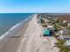 Expansive beach view featuring beachfront homes on a sunny day at 1699 E Ashley Ave # B, Folly Beach, SC 29439