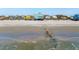 Aerial view of beachfront homes along the coast on a sandy beach with rocks near the water at 1699 E Ashley Ave # B, Folly Beach, SC 29439