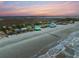 Aerial view of beachfront homes along the coast, showcasing the scenic landscape at 1699 E Ashley Ave # B, Folly Beach, SC 29439