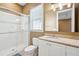 Bathroom featuring a vanity with marble counters and glass-enclosed shower at 1699 E Ashley Ave # B, Folly Beach, SC 29439